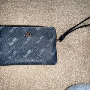 Coach wallet with signature carriage